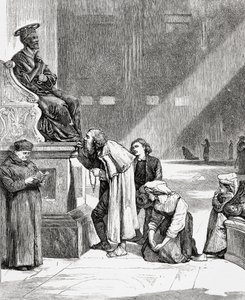 Persone che baciano i piedi della statua di San Pietro all