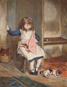 Ragazza che cuce con un gatto ai suoi piedi
