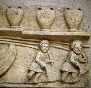 Arte romana: il traino di una barca carica di barili destinati al commercio (dettaglio)