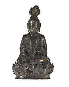 Figura di Guanyin, la dea cinese della misericordia seduta su una base a forma di loto con un corvo posato sulla testa e un coniglio nella mano sinistra
