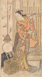 Attore come donna in piedi vicino a uno specchio, ca. 1735 da Torii Kiyotada