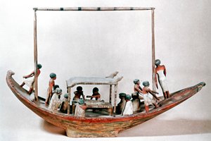 Modello egizio antico di una barca che trasporta una mummia alla sua tomba