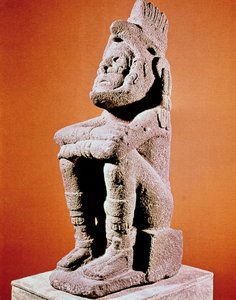 Scultura azteca di una figura maschile seduta
