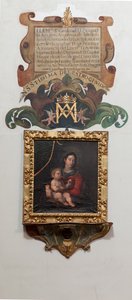 Collegiata. Interno. Dipinto Madonna con il bambino, olio su tela. Un dipinto murale la leggenda (leyenda sobre Nuestra Señora del Patrocinio). Testo: ELEM Sr Cardenal D Pascual DE Aragon Arzobispo de Toledo Es tandovisitando Esta su Yglesia en 20 de d