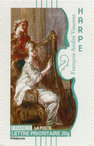 Francobollo francese che mostra una donna che suona l
