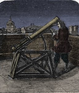 Isaac Newton (1642-1727) fisico inglese che usa il suo telescopio