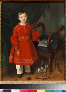 Ritratto di un bambino in abito rosso con giocattoli e un libro dell