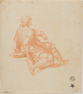 Giovane seduto di profilo