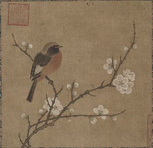 Uccello su un ramo fiorito