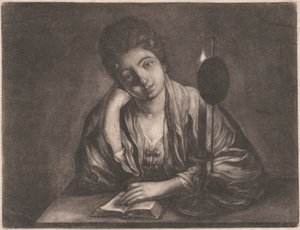 Ragazza che legge alla luce di una candela
