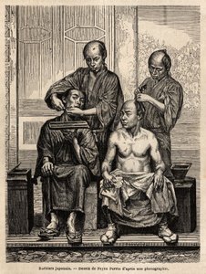 Barbieri giapponesi nel loro negozio, uno che rade una barba, l