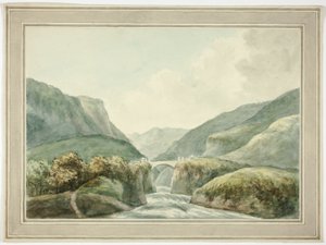 Città di montagna con ponte che attraversa le rapide