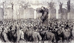 Predicazione di un monaco cappuccino ai pellegrini giunti a Lourdes nei Pirenei dove la Vergine apparve a Bernadette Soubirous nel 1858, attuale luogo di pellegrinaggio. Incisione del 1877 da Unknown artist