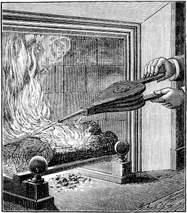 Fuoco in un camino: Un soffietto alimenta la fiamma da . .