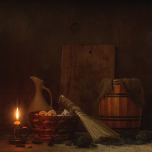 Natura morta rustica con candele da magnola