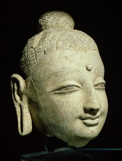 Testa di un Buddha sorridente, stile greco-buddhista, dall