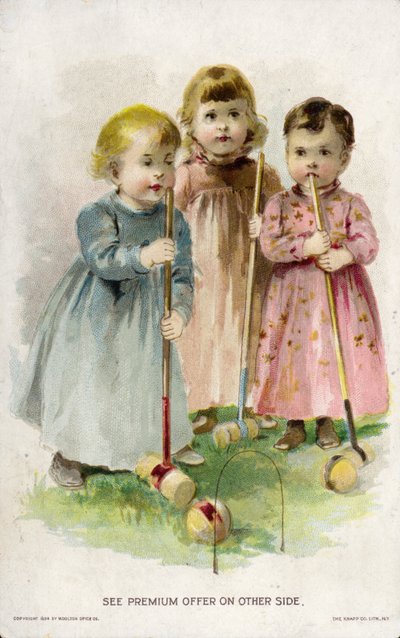 Bambini che giocano a croquet da American School