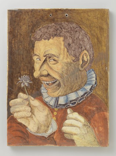 Placca di faience con uomo con fiore da Anonymous