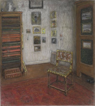 Angolo dello studio con sedia e armadio d