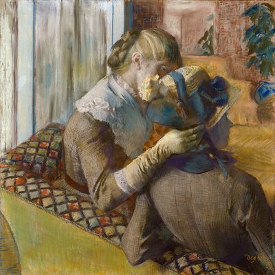 Alla modista. Un cliente prova un cappello da Edgar Degas