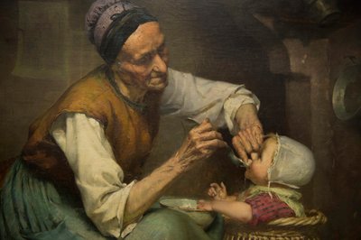 Una vecchia donna nutre la sua nipotina tenuta in un girello di vimini da Edouard Jerome Paupion