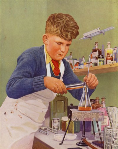Ragazzo che esegue un esperimento di chimica da English School