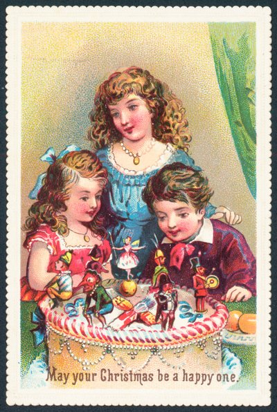 Signora e bambini che ammirano la torta di Natale da English School