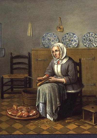 Una donna seduta che prepara cibo in una cucina da Franciscus Carree