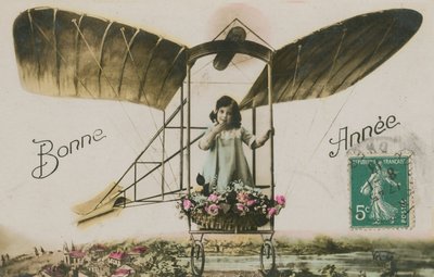 Cartolina di auguri di Capodanno con una ragazza in un aeroplano da French Photographer
