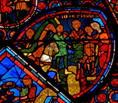 Finestra w24 raffigurante una scena della storia di Giuseppe: i suoi fratelli arrivano e Giuseppe abbraccia Beniamino da French School