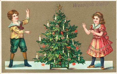 Ragazza e ragazzo con albero di Natale da German School