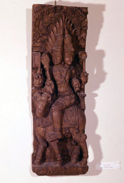 Agni, dio del fuoco, raffigurato con due teste (bicefalo) su un ariete, secondo la mitologia indù. Scultura in legno del XVII secolo. Parigi, Musée Guimet. da Indian School