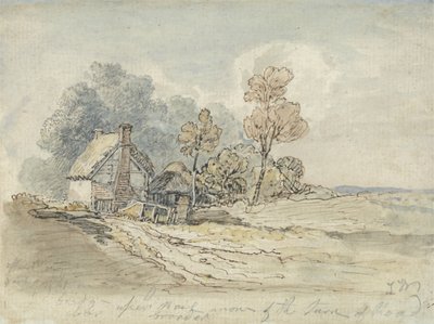 Un cottage con tetto di paglia e alberi all