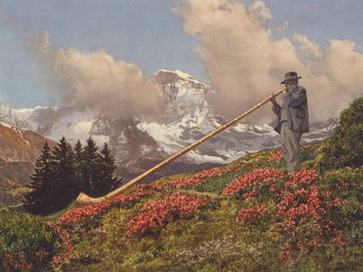 Svizzera: Un suonatore di corno delle Alpi, con lo Jungfrau sullo sfondo da Jean Gaberell