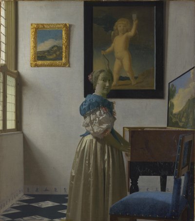 Una giovane donna in piedi davanti a un virginale da Johannes Vermeer
