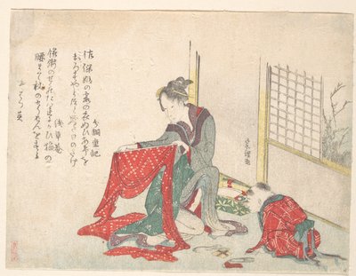 Donna che piega un panno da Katsushika Hokusai