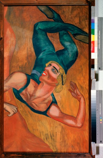 Salto - Un acrobata esegue un salto, il viso sorridente, il corpo flessibile deformato dalla posa in sospensione nell