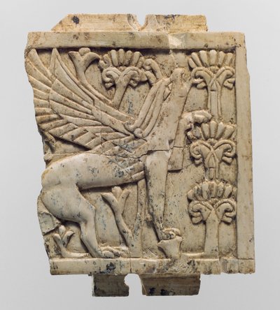 Placca di mobili scolpita in rilievo con un grifone in un paesaggio floreale da Neo Assyrian