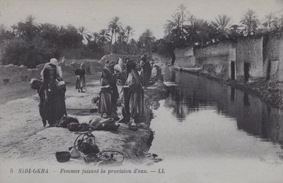Donne che raccolgono acqua a Sidi-Okba, Algeria da Photographer French