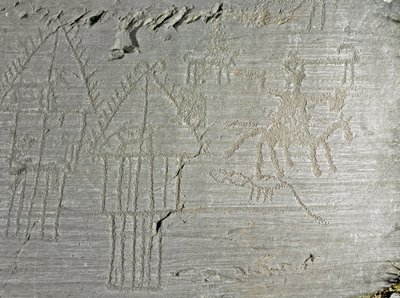 Preistoria, civiltà dei Camuni, arte rupestre: roccia tombale con scene di vita quotidiana in un villaggio, capanna su palafitte, case sul lago, cani, uccelli, cervi e uomo a cavallo da Prehistoric Prehistoric