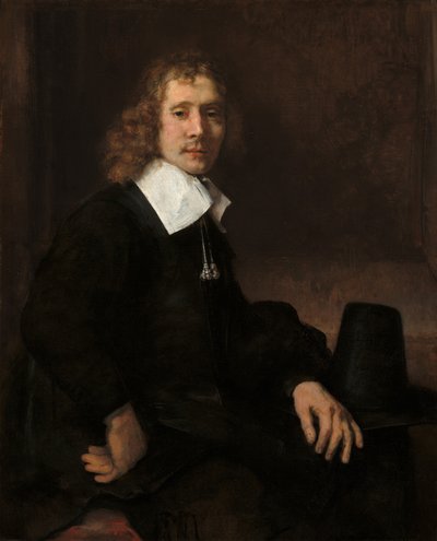 Un giovane seduto a un tavolo (possibilmente Govaert Flinck) da Rembrandt van Rijn