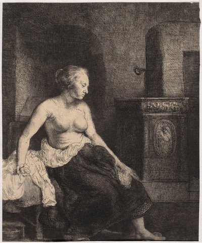 Una donna seminuda seduta accanto alla stufa da Rembrandt van Rijn