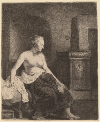 Donna seduta mezza vestita accanto a una stufa da Rembrandt van Rijn