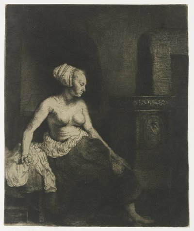Donna seduta mezza vestita accanto a una stufa da Rembrandt van Rijn