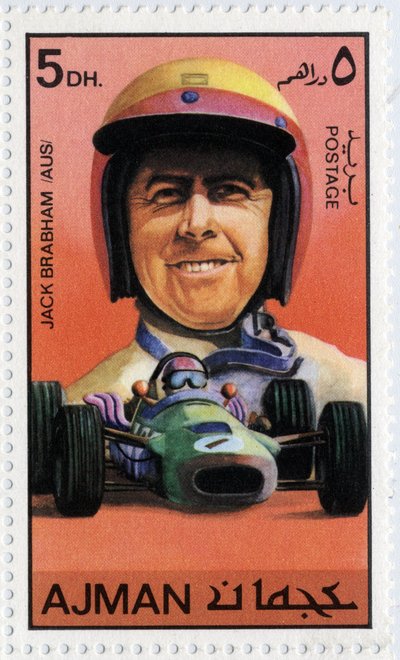 Francobollo degli Emirati Arabi Uniti che rappresenta il pilota automobilistico australiano Jack Brabham (nato nel 1926) da School Arabic