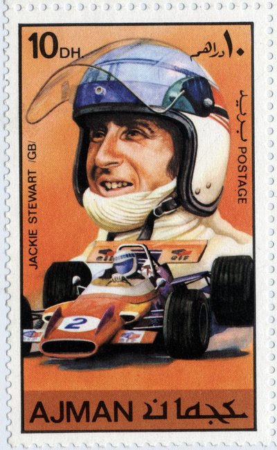 Francobollo degli Emirati Arabi Uniti che rappresenta il pilota automobilistico scozzese Jackie Stewart (nato nel 1939) da School Arabic