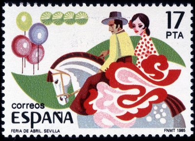 La Feria di Siviglia: coppia in costume tradizionale a cavallo - francobollo spagnolo da Spanish School