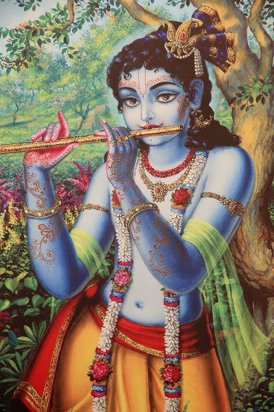 Dipinto che raffigura il dio indù Krishna che suona il flauto all