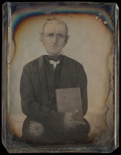 [Ritratto di un uomo con baffi da montone che stringe un libro.] da Unknown artist