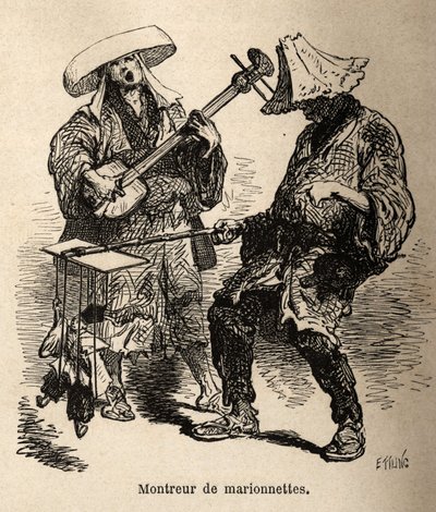 Lo spettacolo di burattini e il musicista che lo accompagna per l